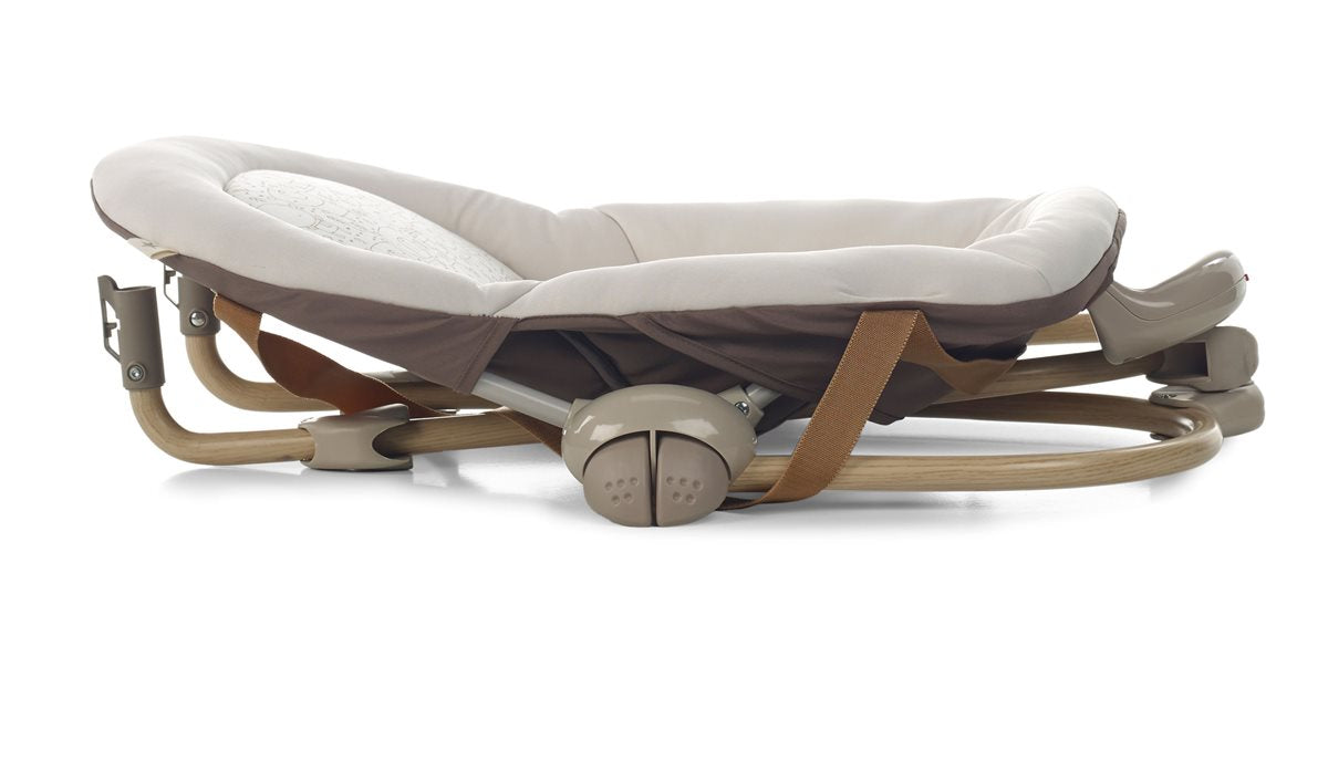 Foldable baby bouncer with beige cushion on a white background