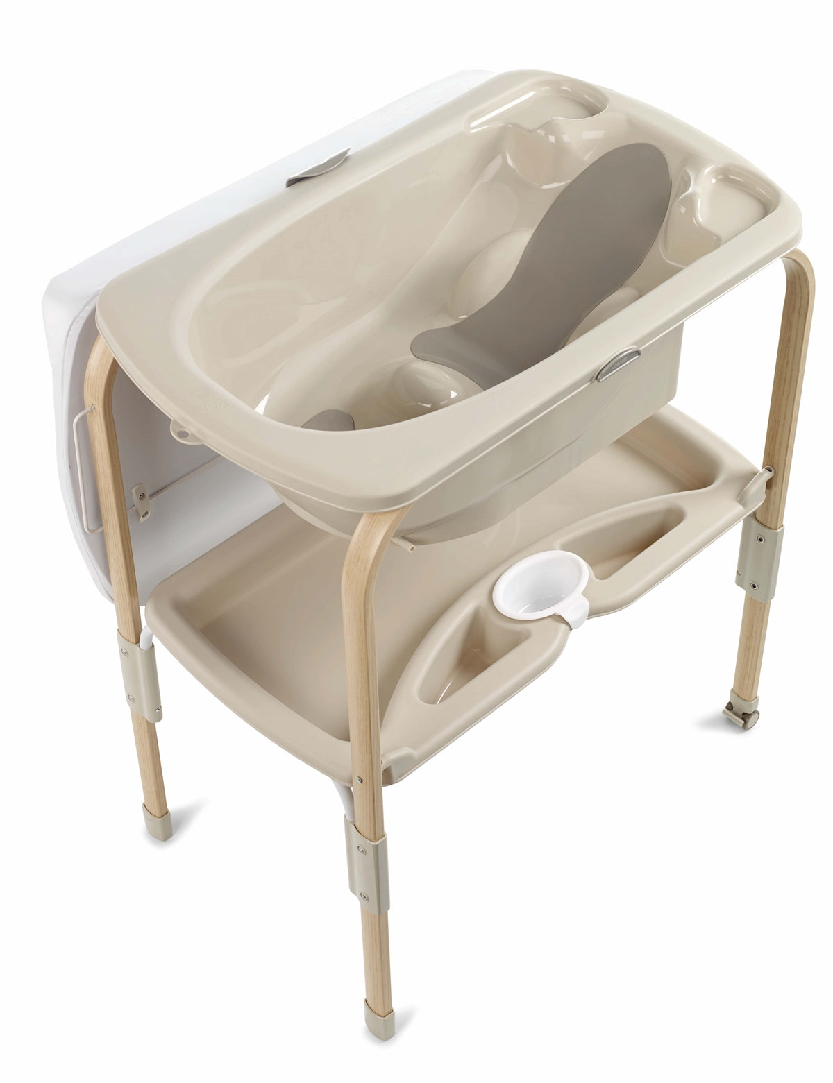 Beige baby changing table with tray and seat on a white background
