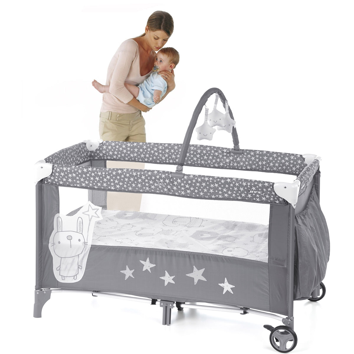 Gray baby crib with star patterns and a child and adult in the background