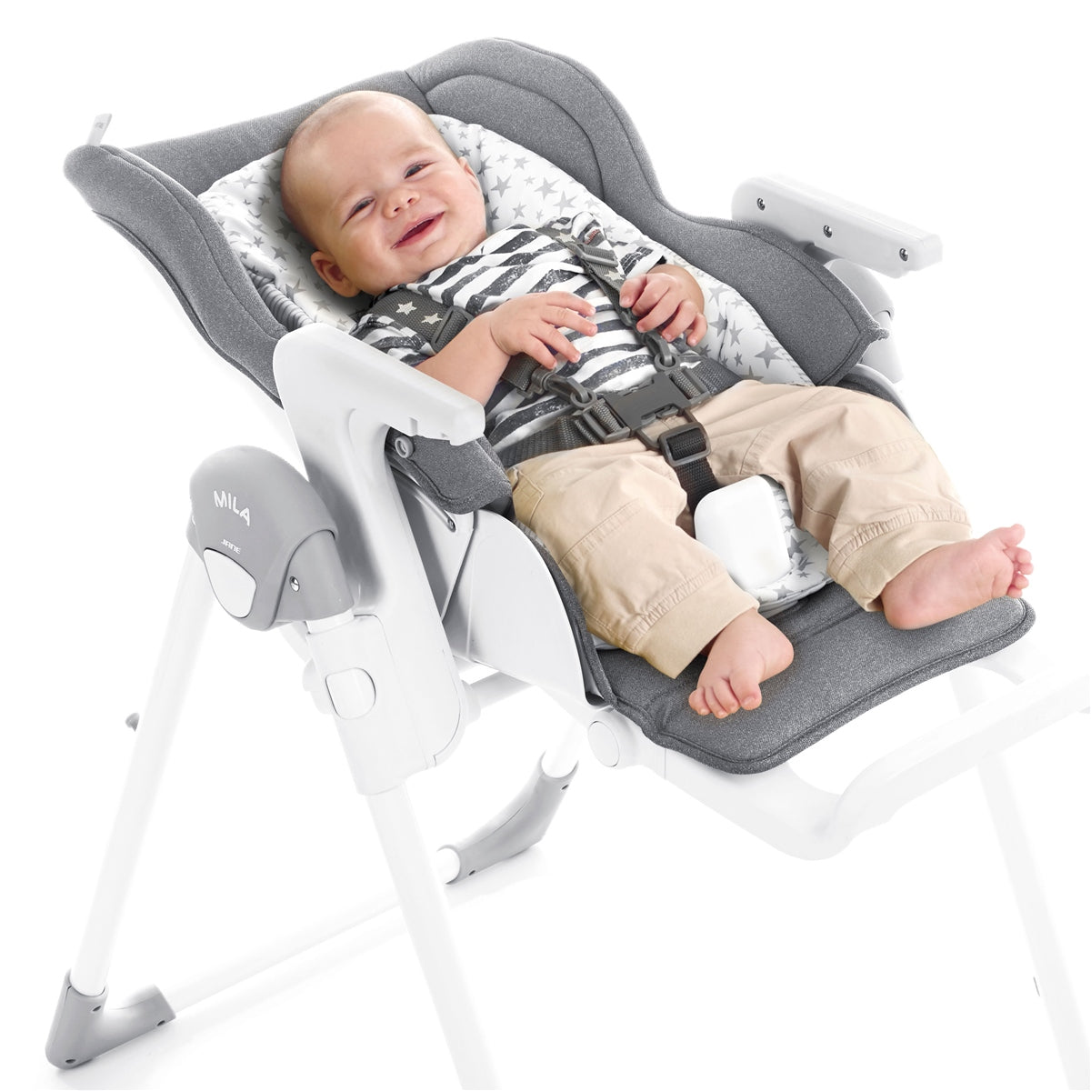 Baby in a gray and white baby seat with a smiling expression on a white background