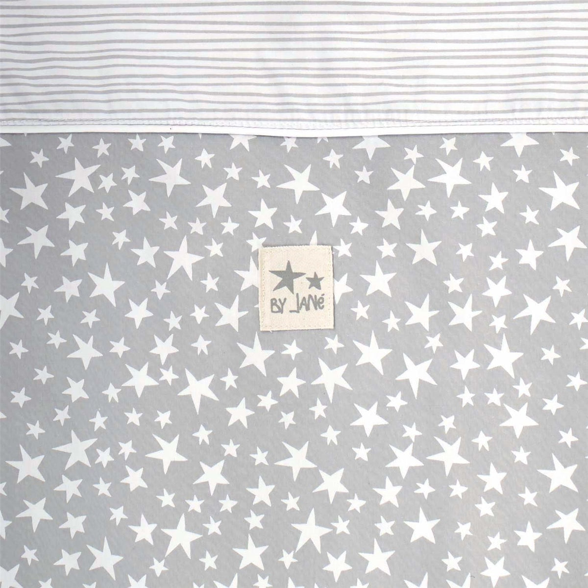 Gray fabric with white star pattern and a brand label on a white background
