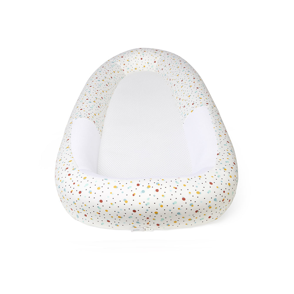 Speckled baby bed on a white background