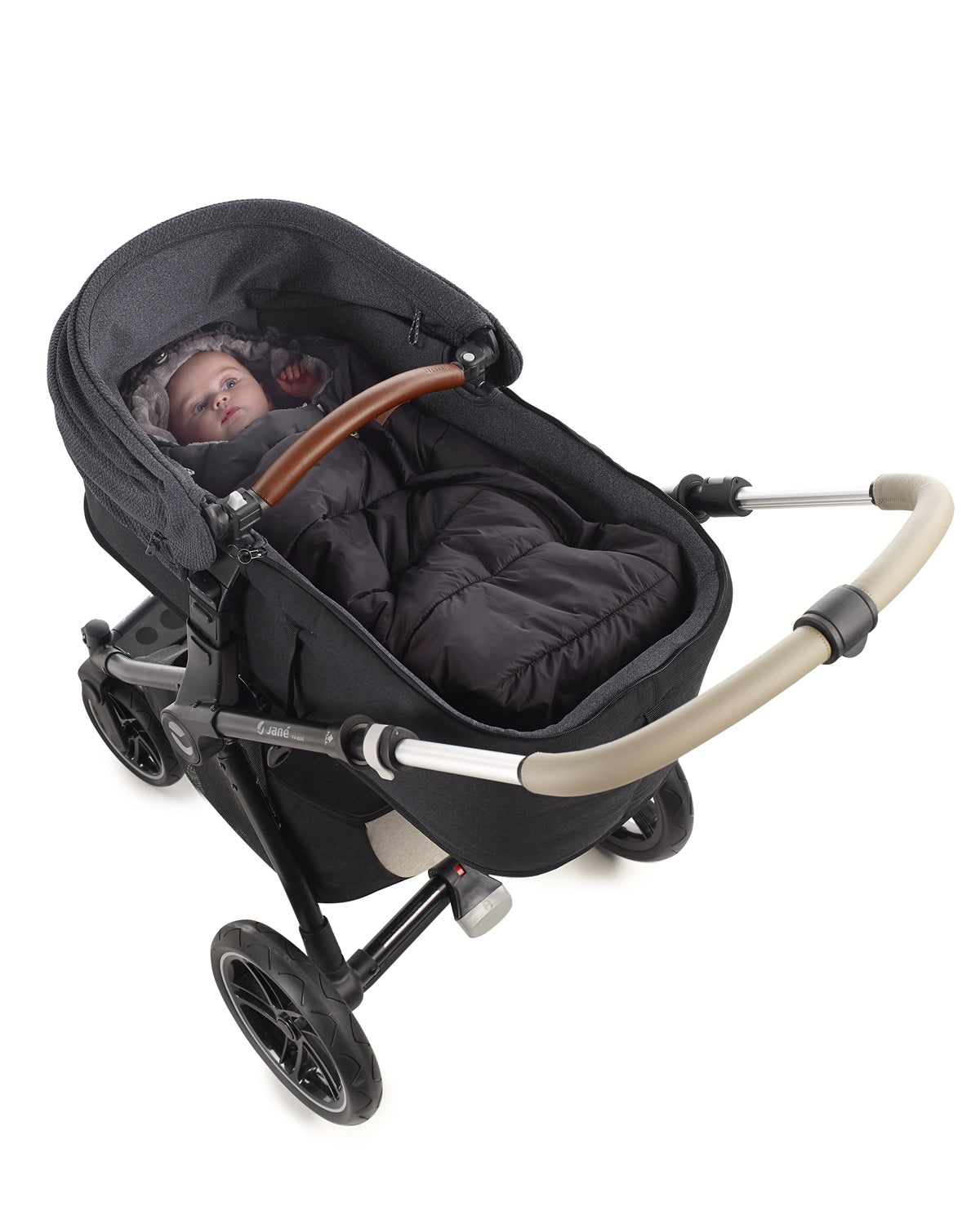 Black baby stroller with beige handle on a white background