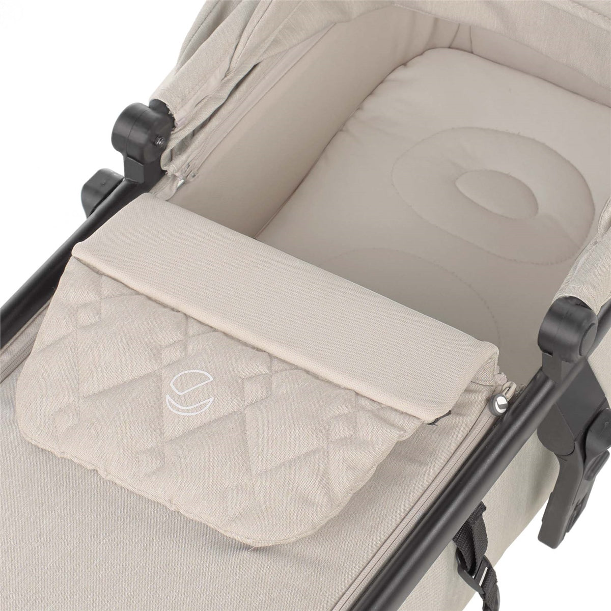 Beige baby stroller with a storage basket on a white background