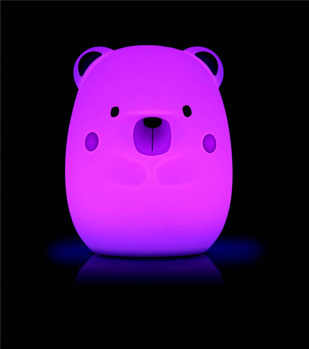 Purple bear-shaped night light on a black background