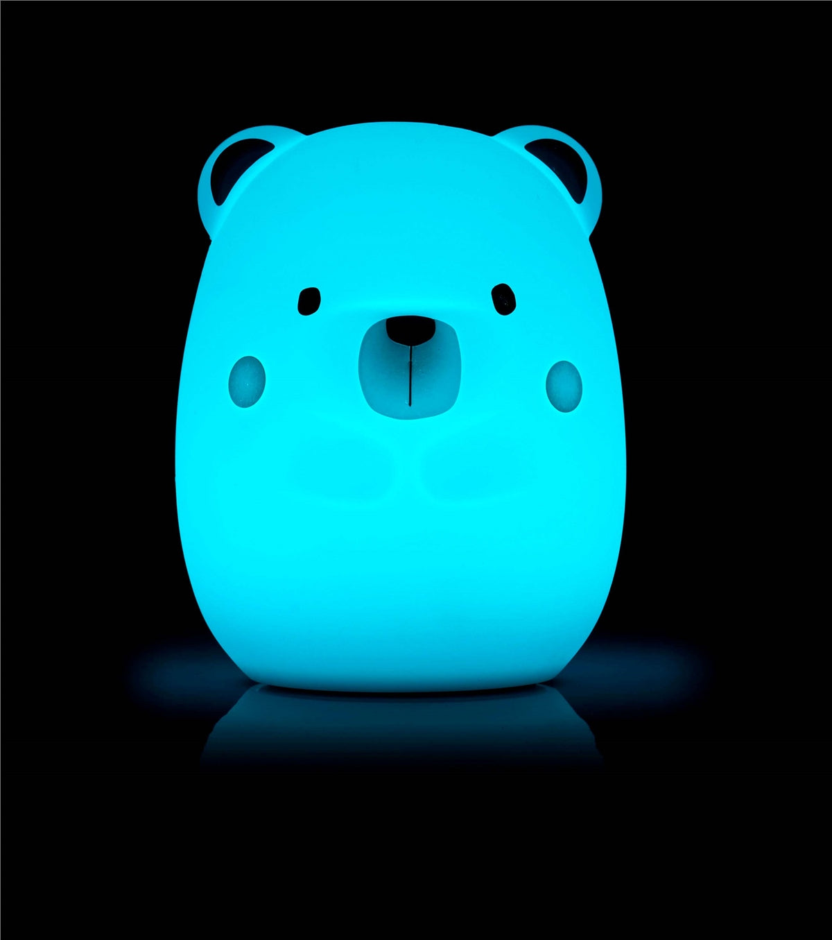 Blue bear-shaped night light on a black background