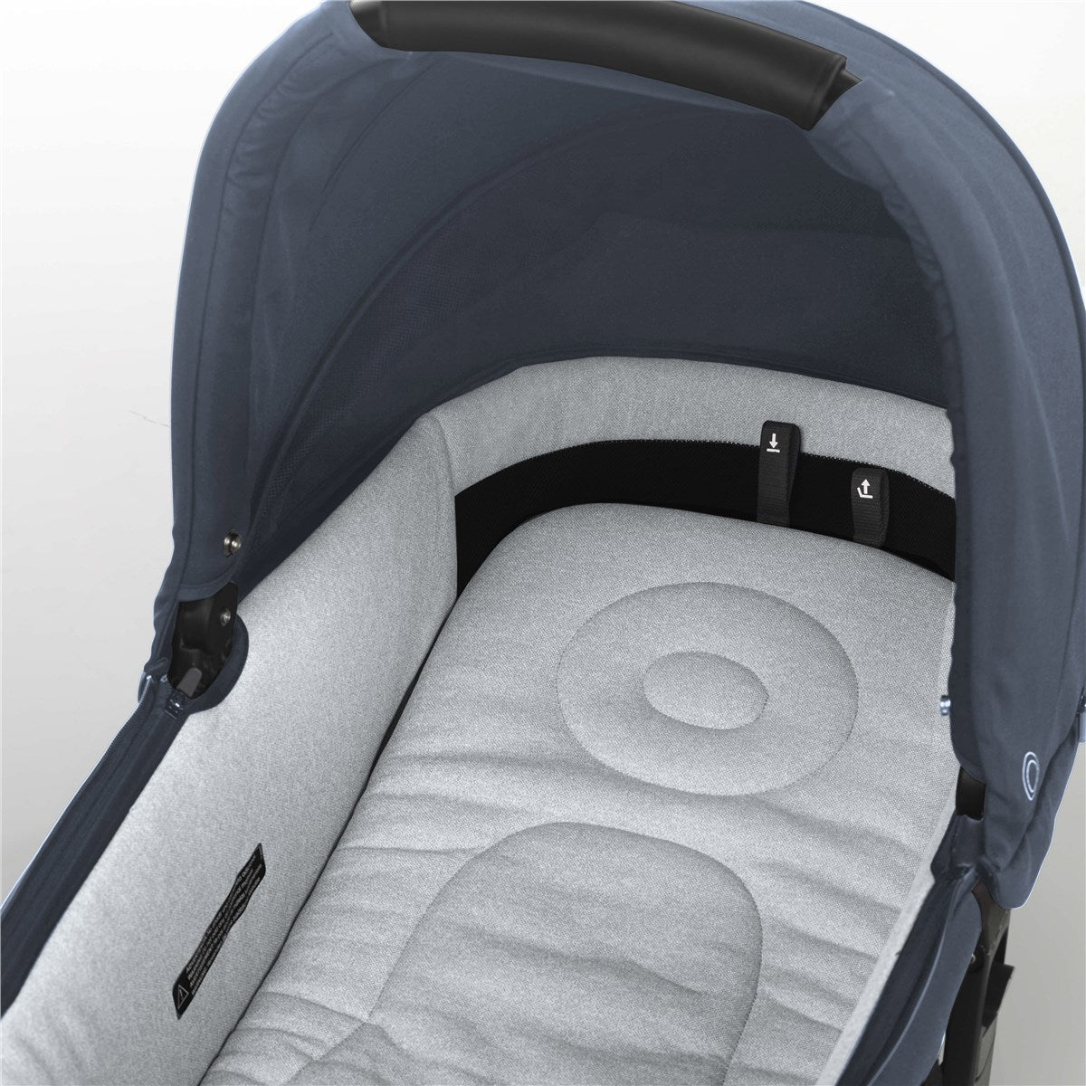 Close-up of a baby car seat with a dark blue canopy on a light gray background