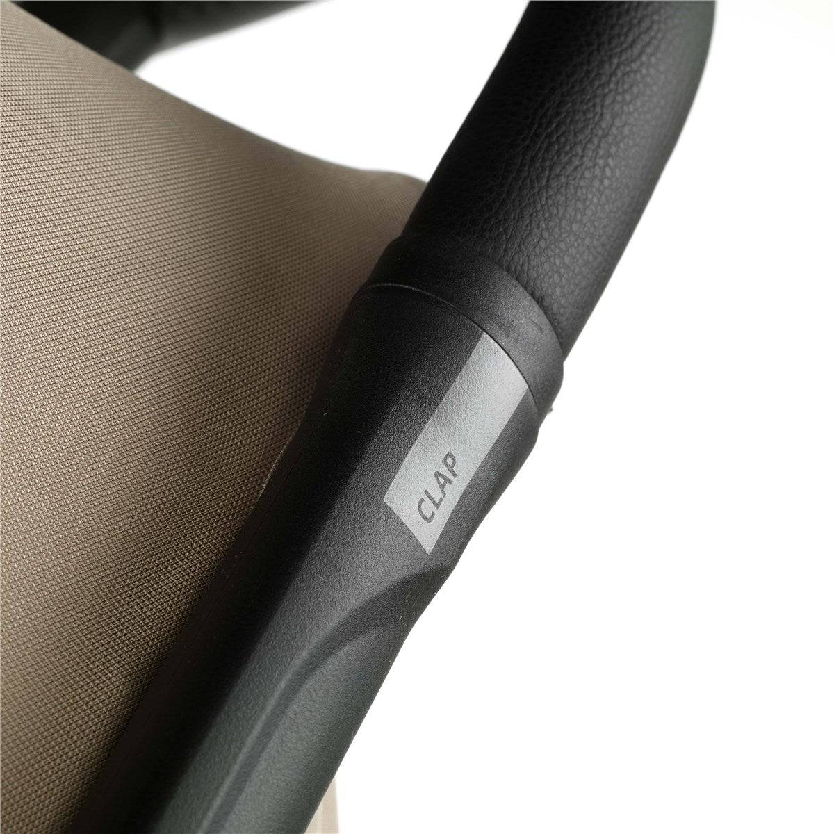 Close-up of a chair stroller handle with 'CLAP' branding on a white background