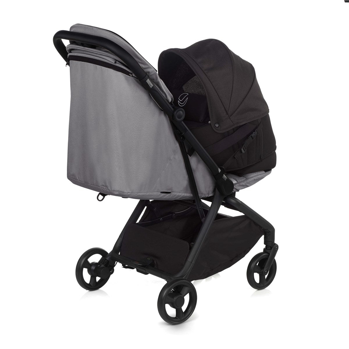 Black and gray baby stroller on a white background