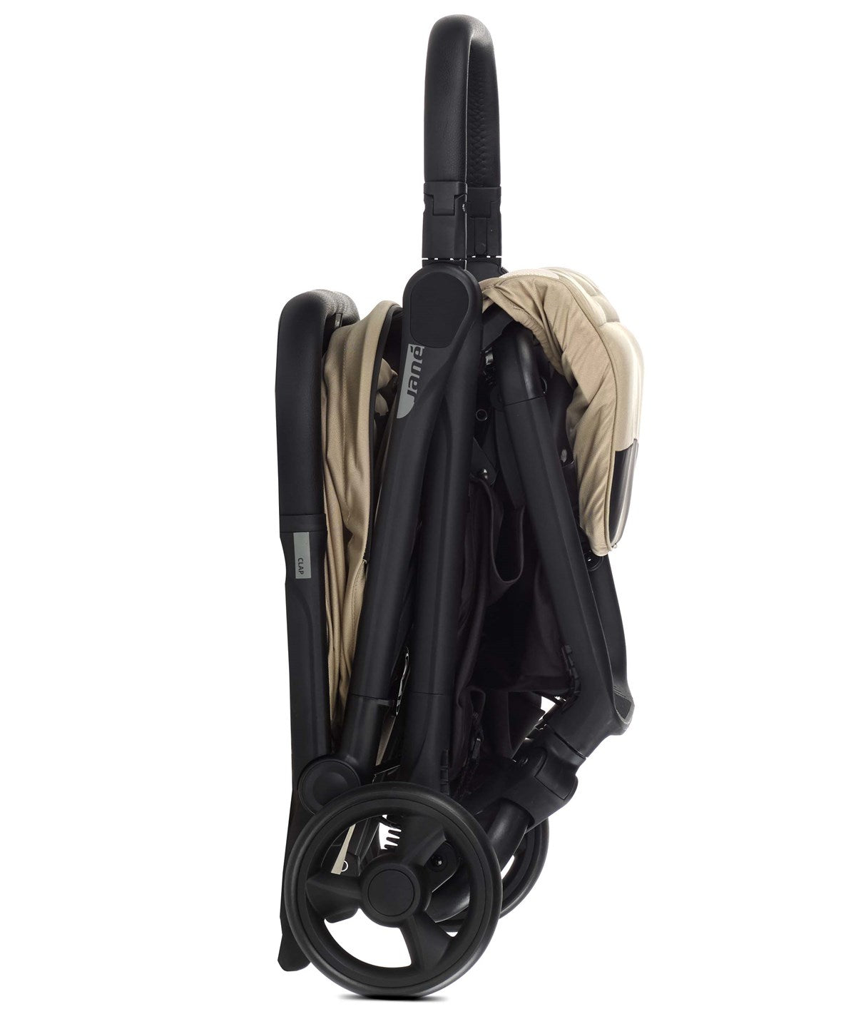 Folded black stroller with beige cover on a white background