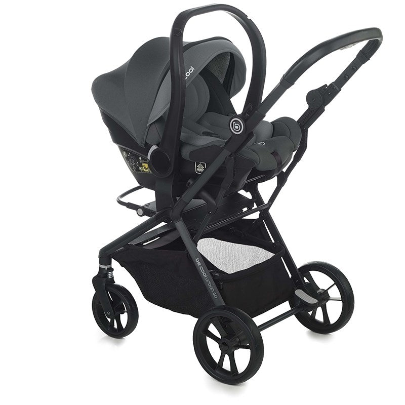 Black stroller with baby seat on a white background