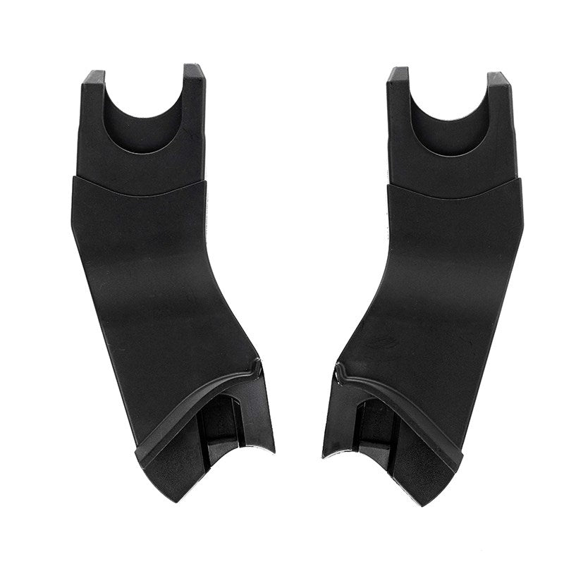 Pair of black plastic car seat anchors on a white background