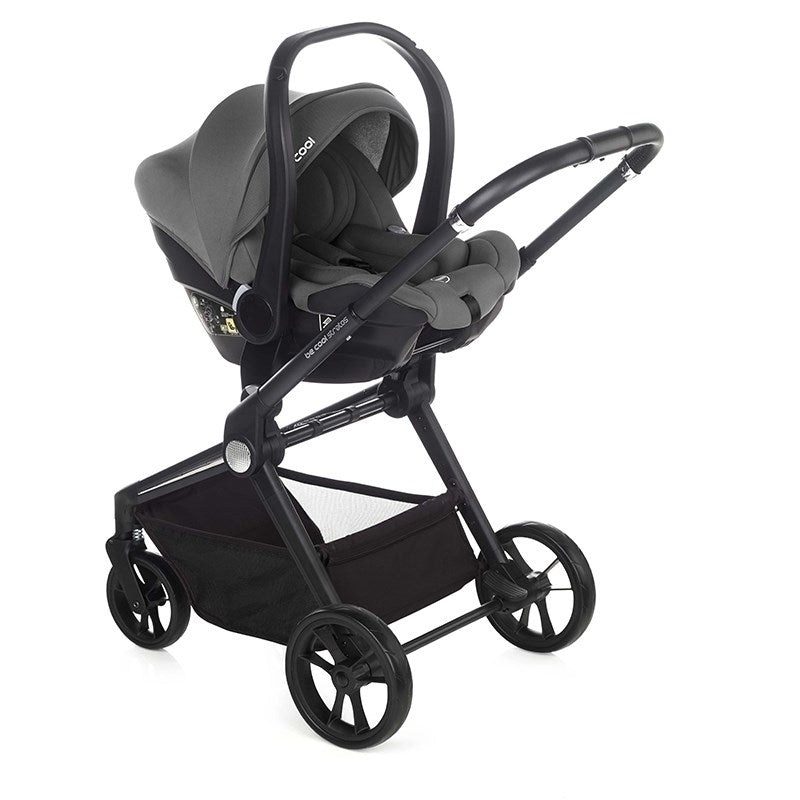 Black and gray stroller with car seat on a white background
