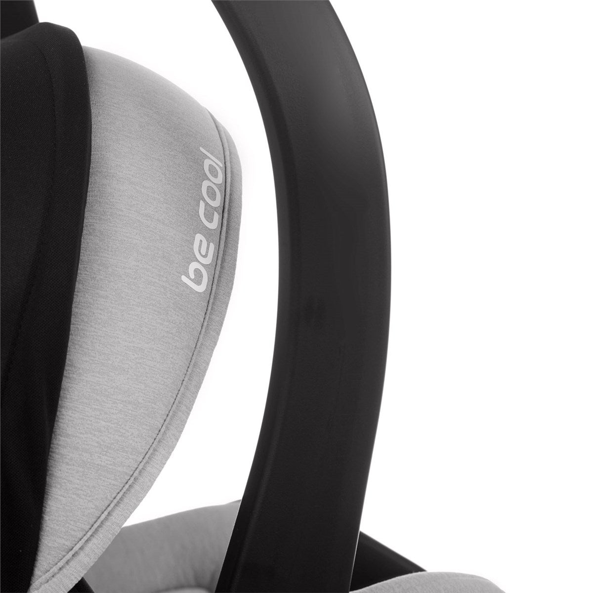 Close-up of a car seat with 'be cool' branding on a white background