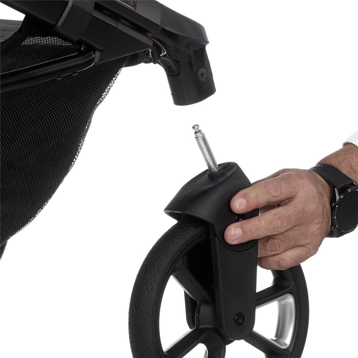 Person adjusting a stroller wheel with a tool on a white background
