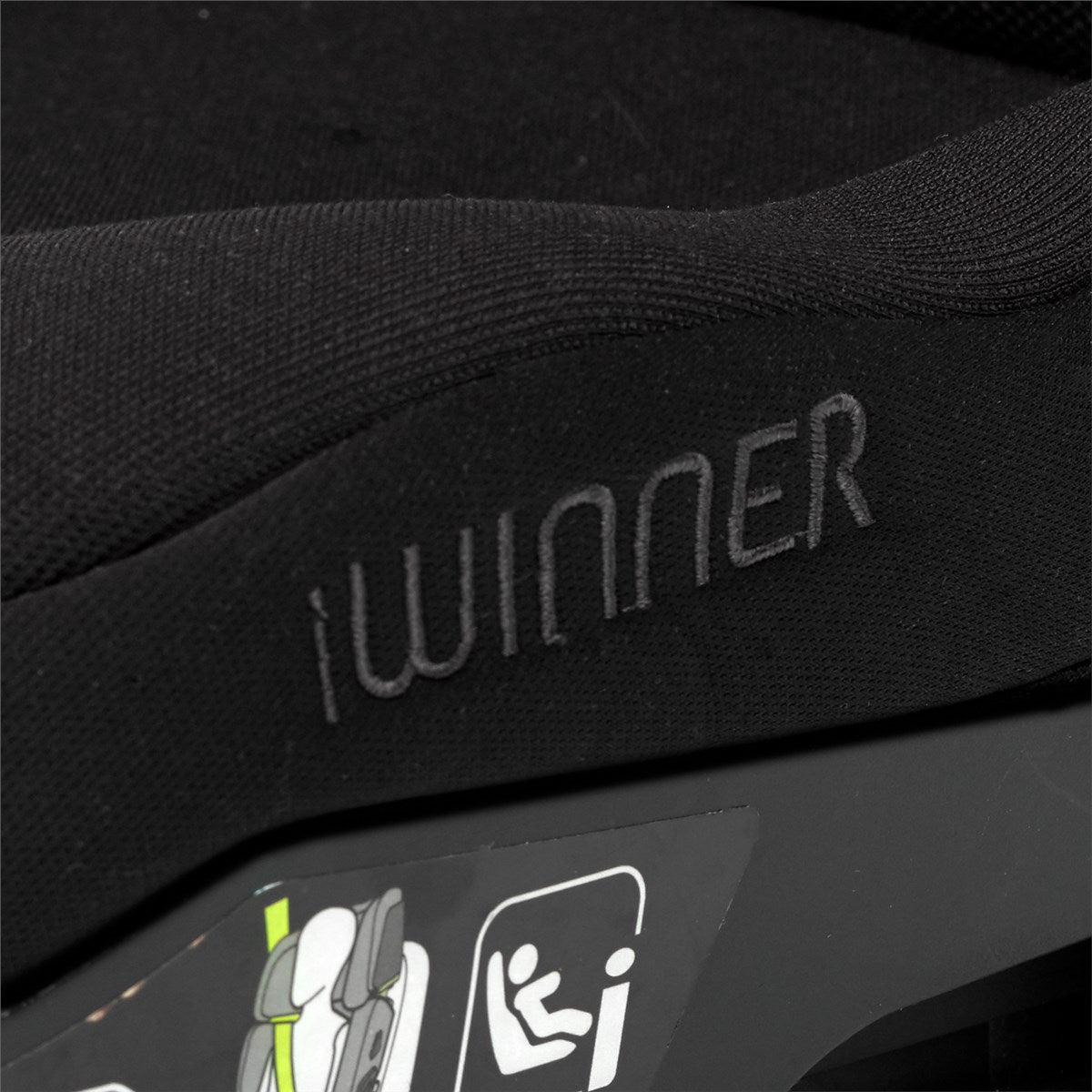 Close-up of a black car seat with 'iwinner' branding and safety icon.