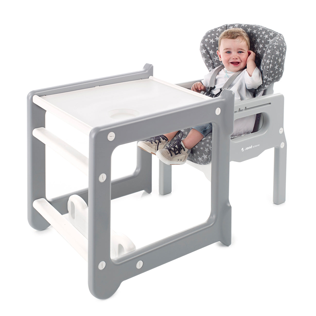 Child in a gray and white high chair with a tray extension on a white background