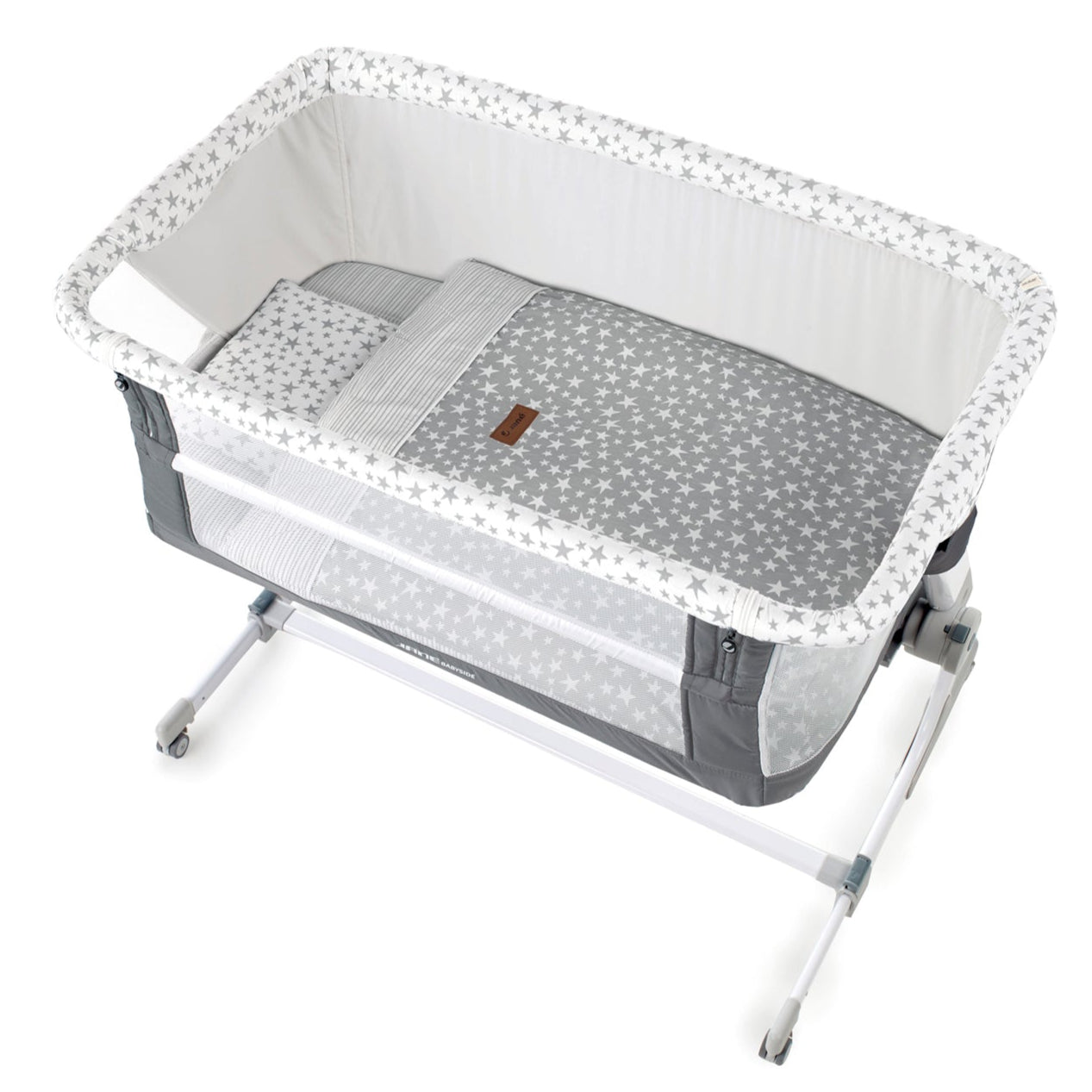 Portable baby crib with gray mattress and star pattern on a white background