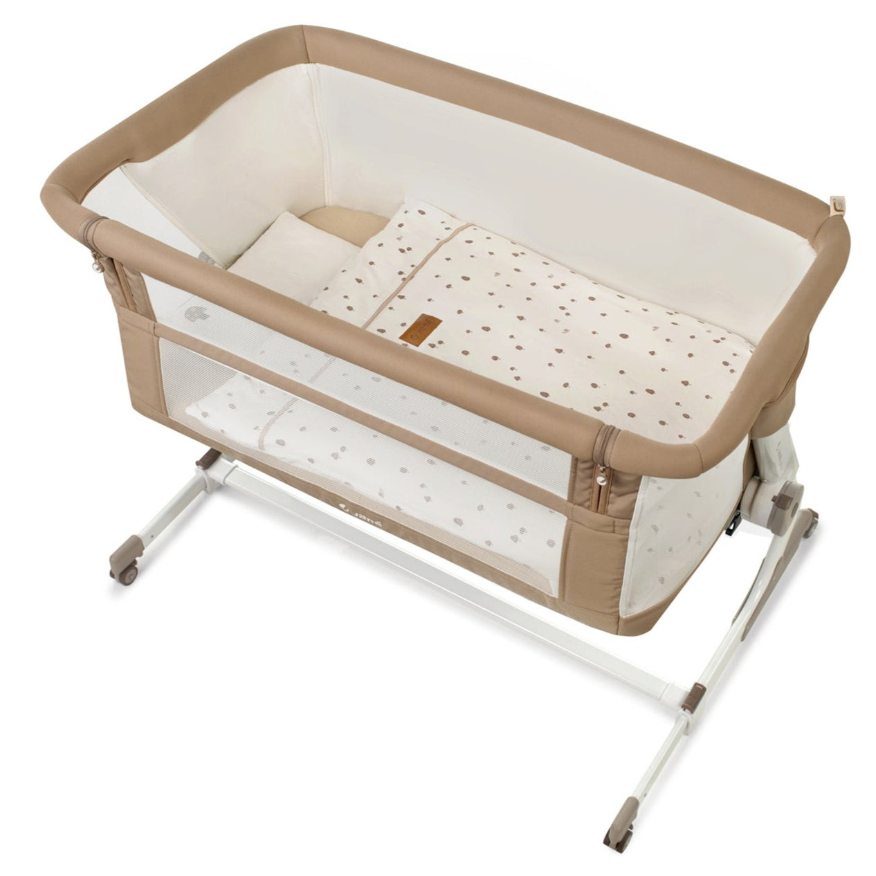 Beige and white baby crib with a pillow on a white background