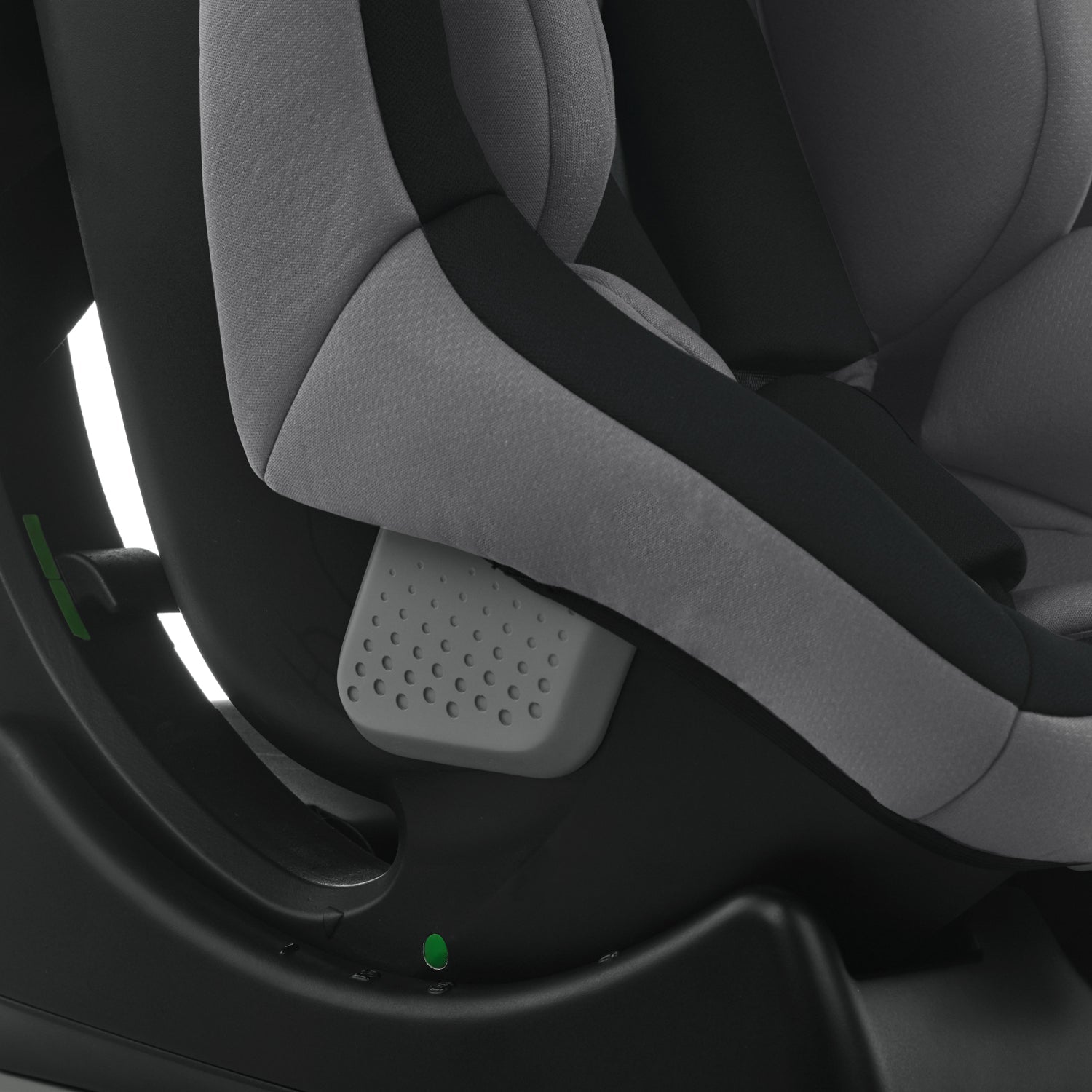 Gray car seat with a focus on the headrest and shoulder strap.