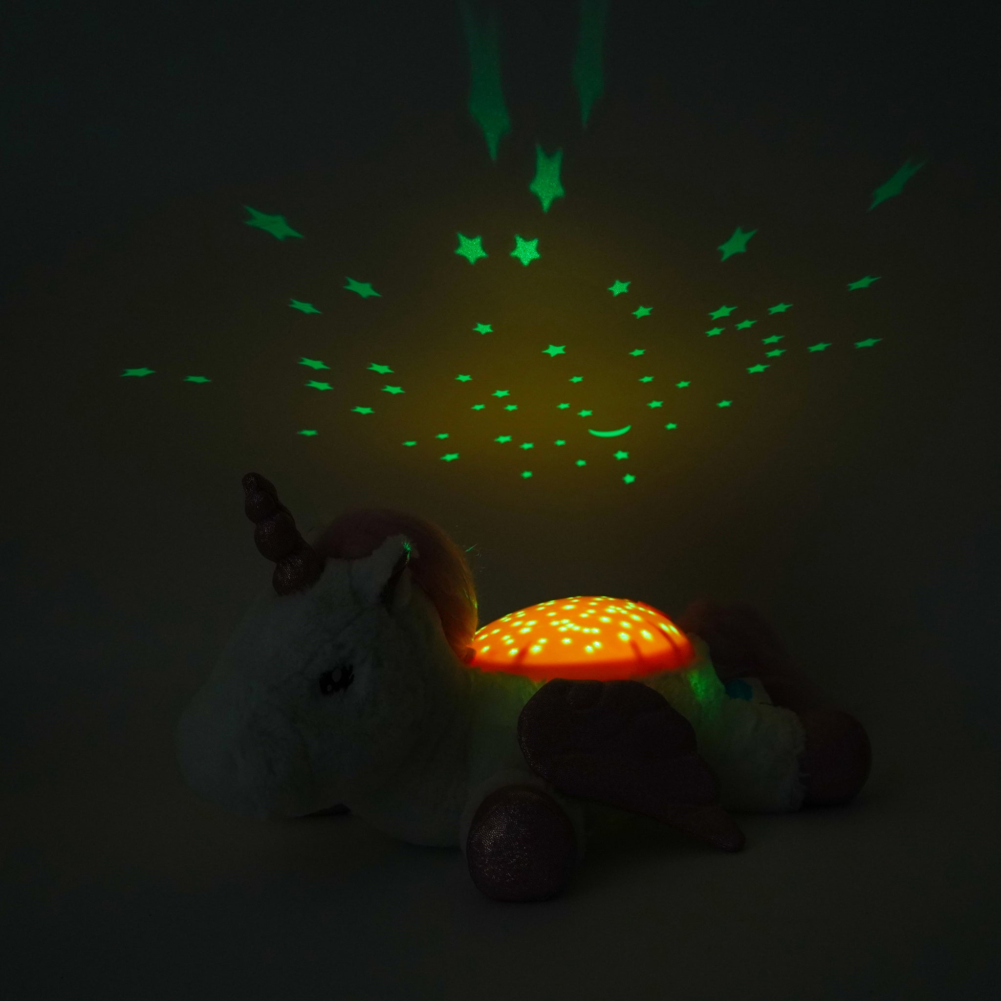 Children's night light with star and moon projections on a dark background