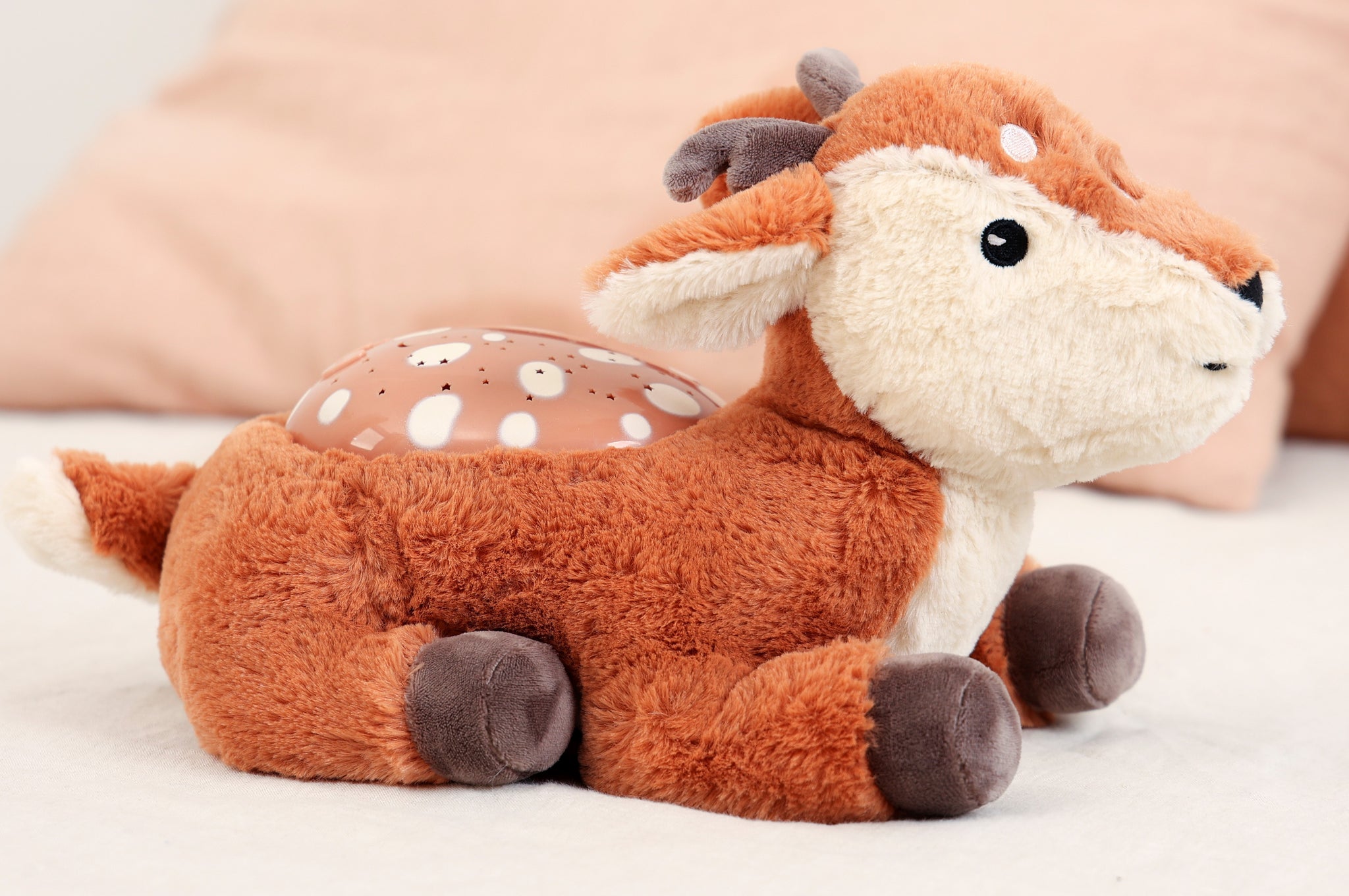 Plush deer toy with a soft texture on a light background