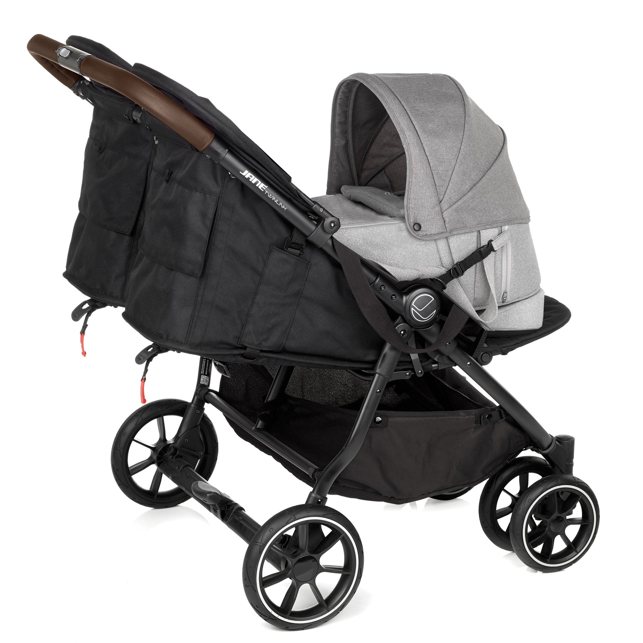 Black and gray stroller with a baby seat on a white background