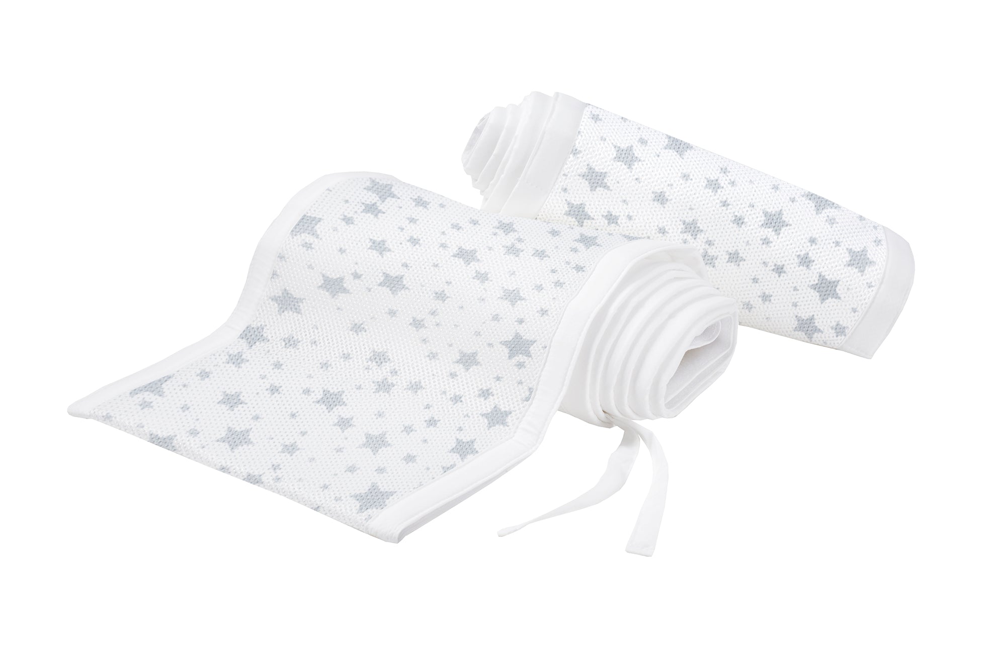 Two rolled-up baby bumpers with star pattern on a white background