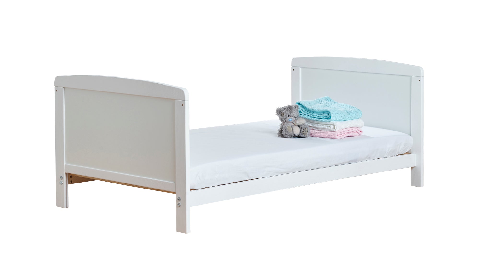 Grey children's bed with a mattress and toys on a white background