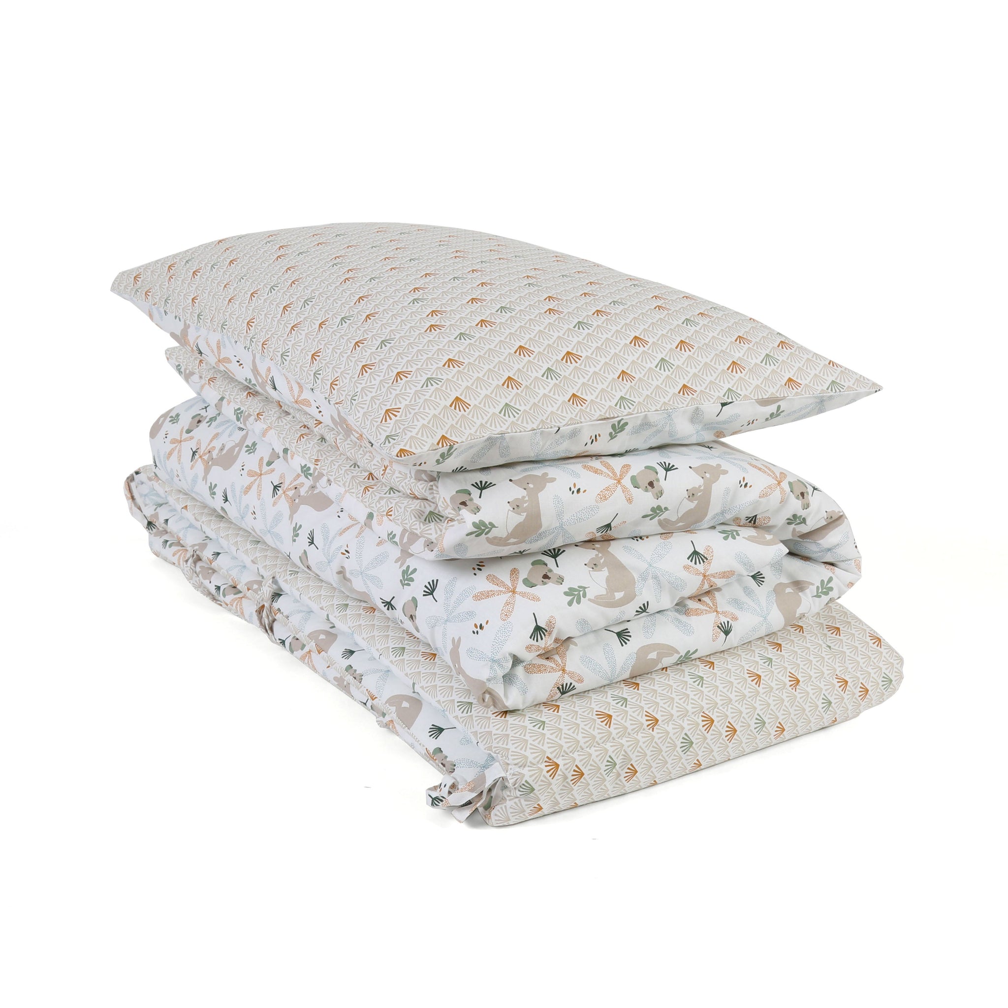 Folded quilt with animal pattern and matching pillow on a white background