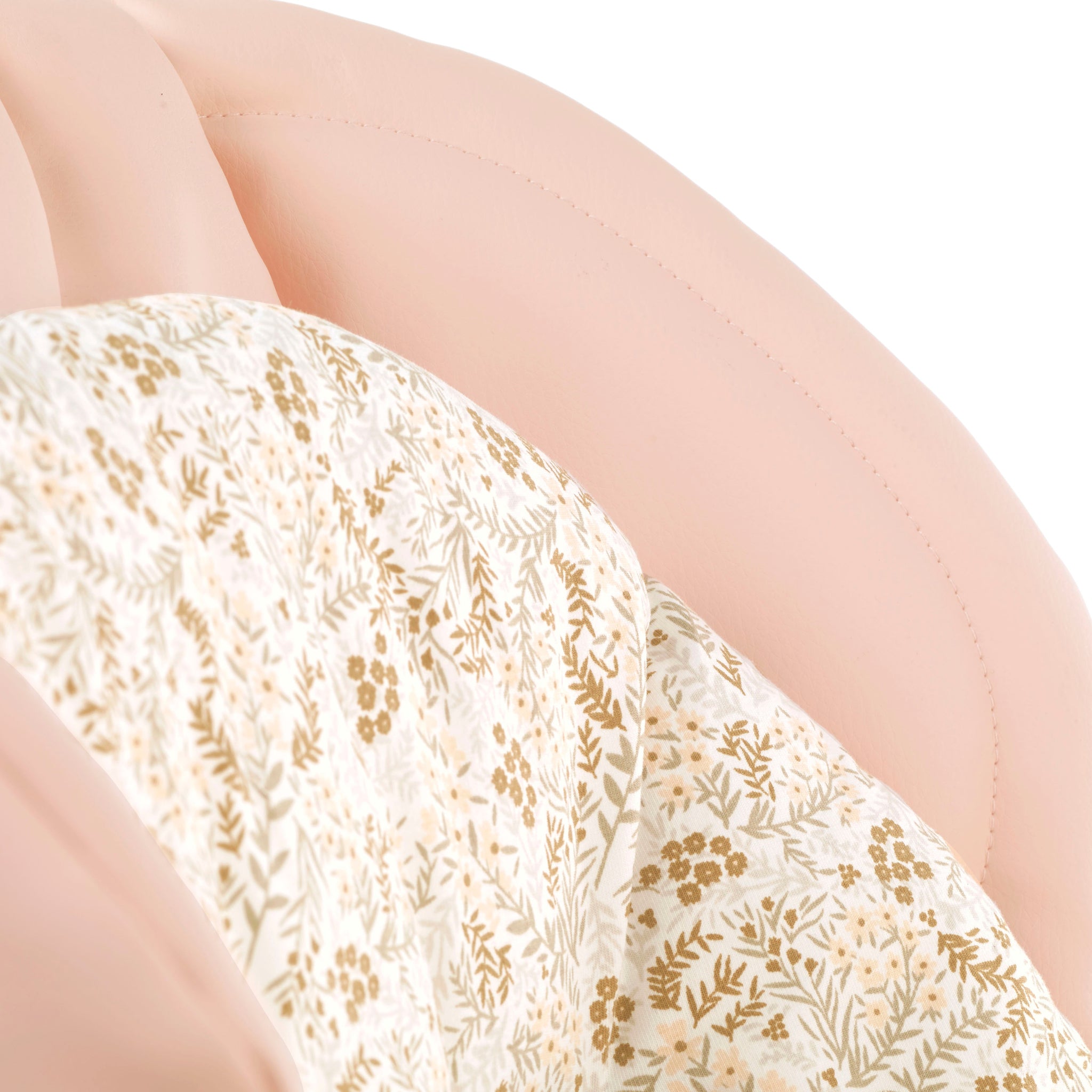 Close-up of a floral-patterned chair with a white background