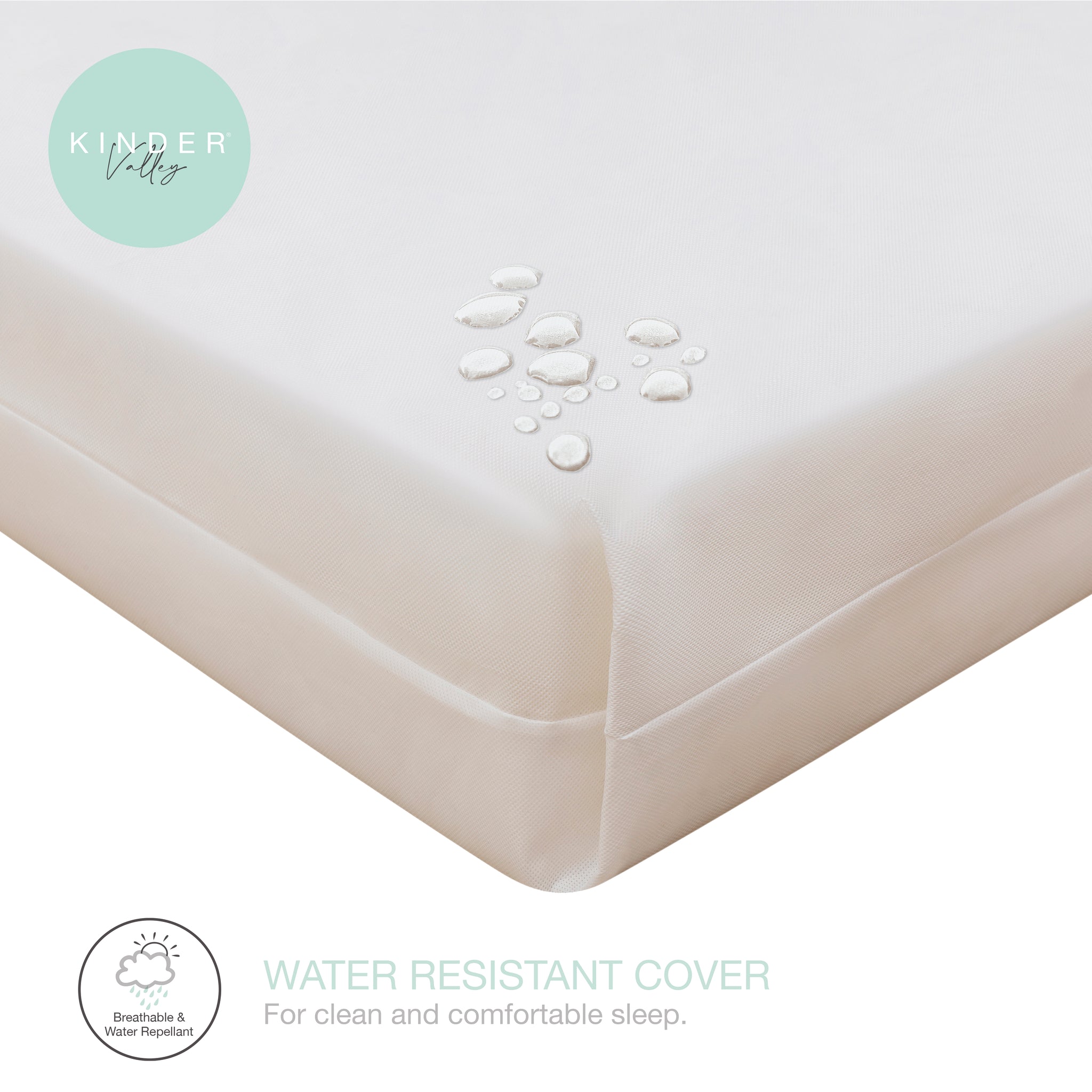 Water-resistant mattress cover with Kinder Valley branding and water droplet graphics.