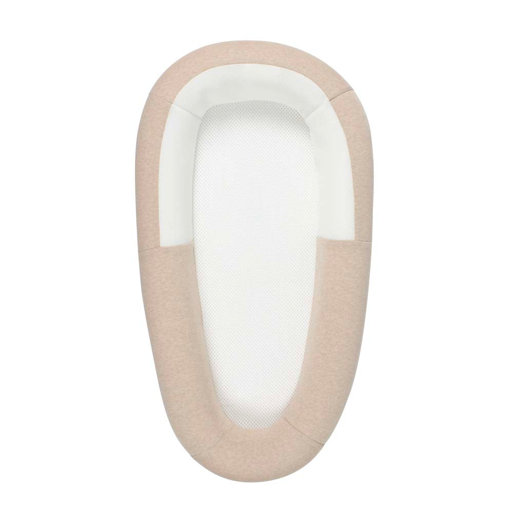 Beige and white baby bed with a soft interior on a white background