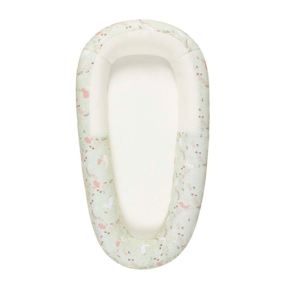 patterned white and pink baby bed on a white background