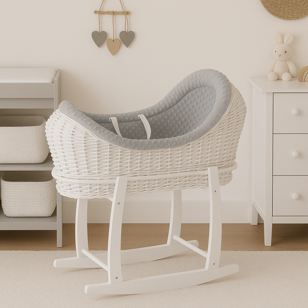White wicker baby crib with gray cushion in a nursery setting